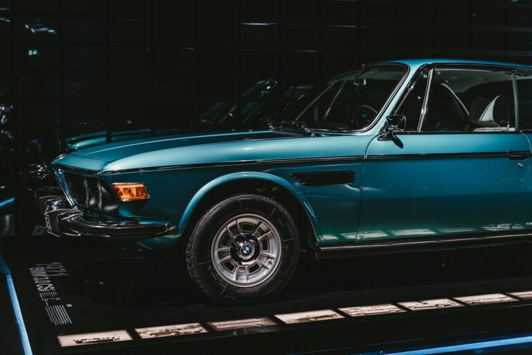 blue car parked in garage