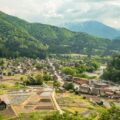 houses and rice paddies at the valley with river