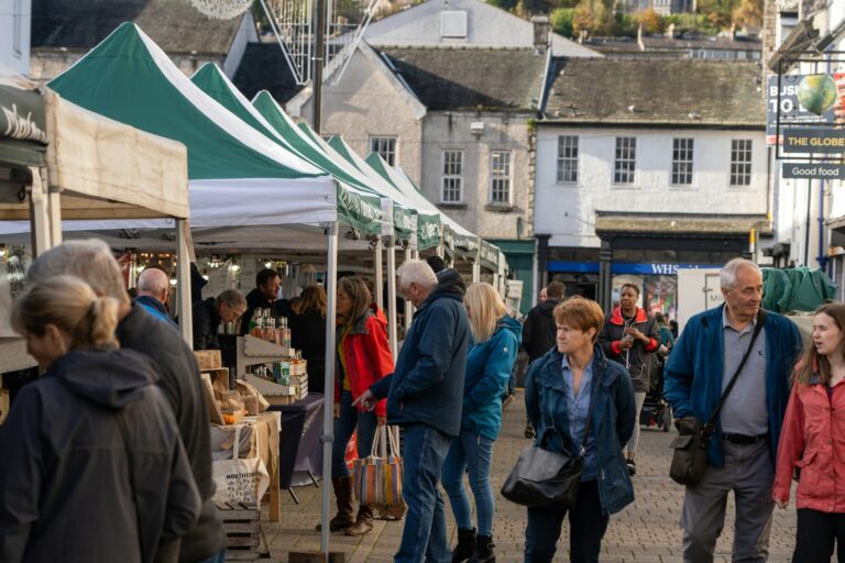 a group of people at an outdoor market