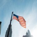 USA flag on pole at the city during day