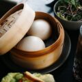 Steamed buns in a bamboo steamer.