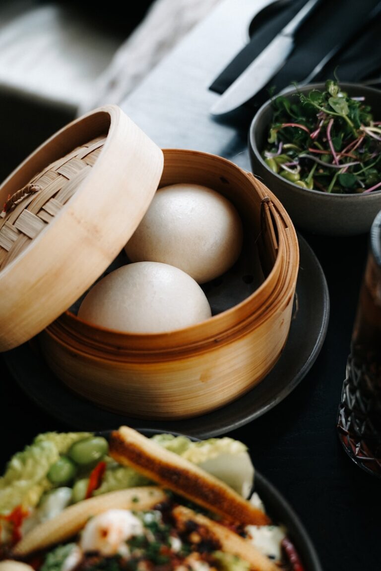 Steamed buns in a bamboo steamer.