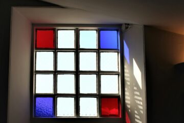 a window with a red and blue light