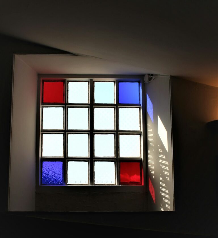 a window with a red and blue light