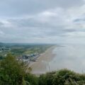 a view of a beach from a hill