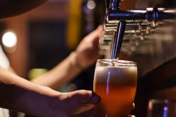 person holding drinking glass