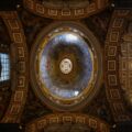 The ceiling of a building with a painting on it