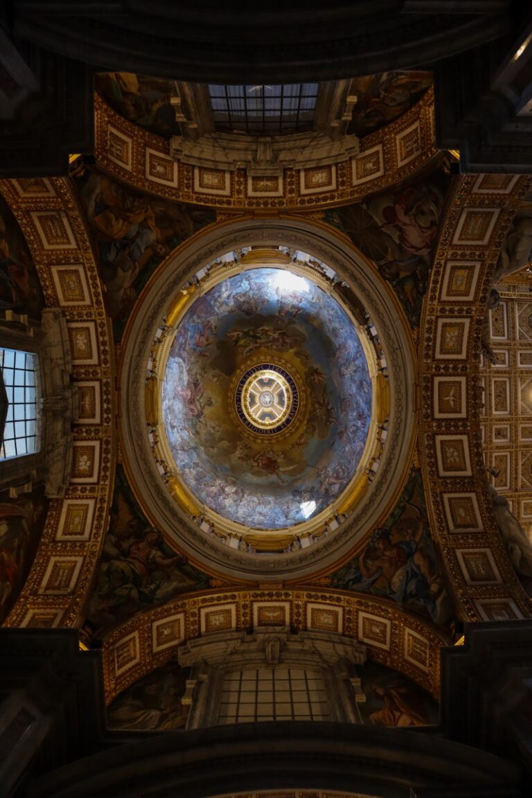 The ceiling of a building with a painting on it