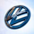 silver mercedes benz emblem on white surface