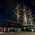 a tall ship sitting on top of a building