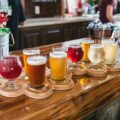clear drinking glasses on brown wooden table