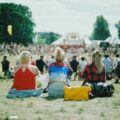 group of people on grass field under sunny day