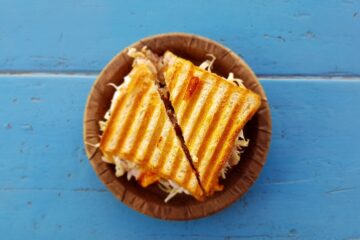 two slices of sandwich on brown container