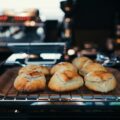 seven buns on gray steel grill