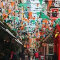 street with multicolored fiesta flags during daytime