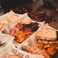 a tray of sandwiches and chips on a table