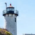 white and black lighthouse under white sky during daytime