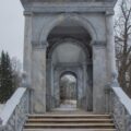 A stone arch with steps leading up to it