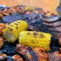grilled meat with corn on top