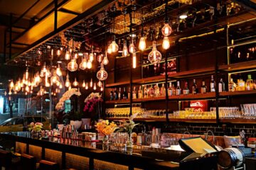 turned-on filament bulb lights at bar counter