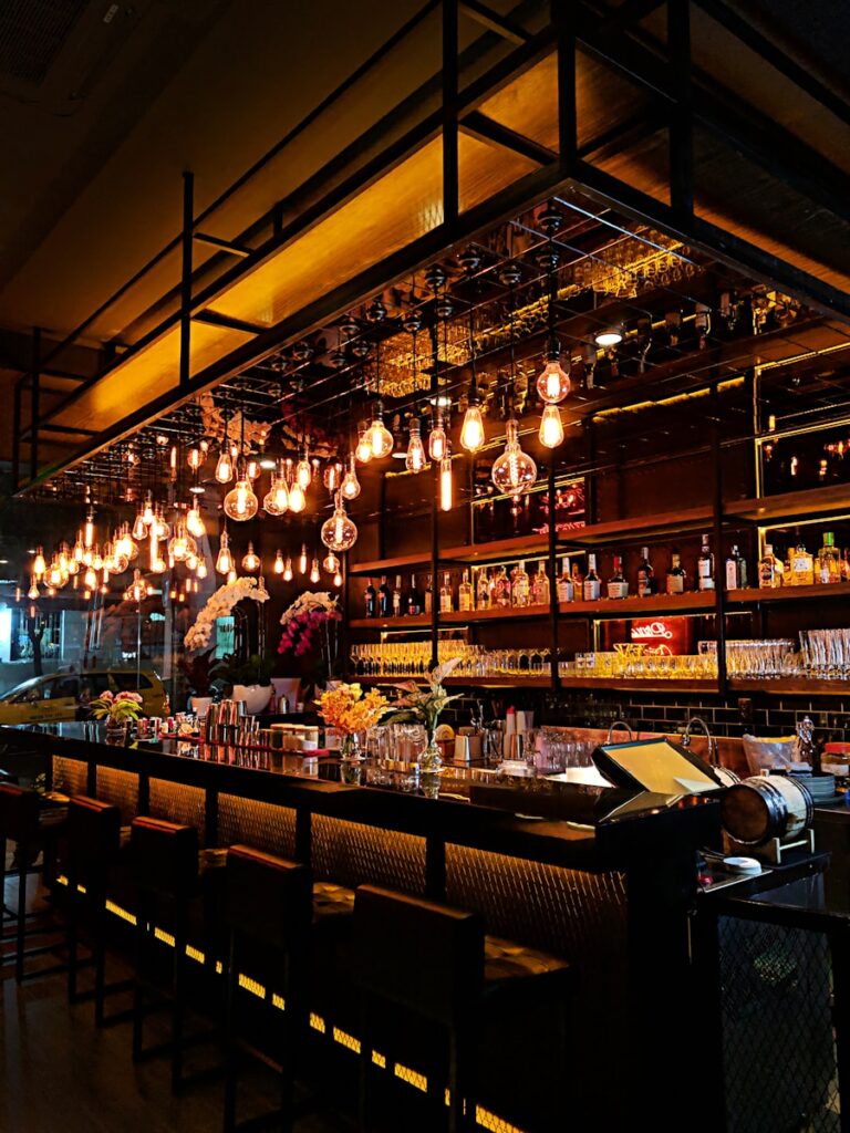 turned-on filament bulb lights at bar counter